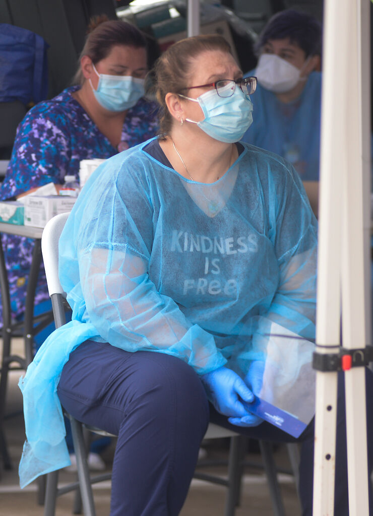 Nurse practitioner Hillarie Graham prepares for patients who are signing in